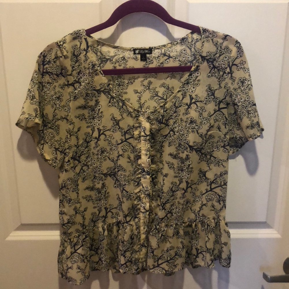 Summer top with ruffles and cute button detail